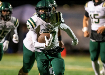 The Monterey Trail Mustangs’ Gabe Coronado (30) breaks loose for the go-ahead 32-yard touchdown against the Elk Grove Thundering Herd in the fourth quarter on Friday.